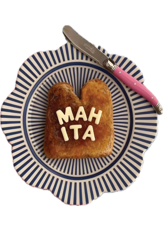 Mahita Manikandan plating a slice of butter toast